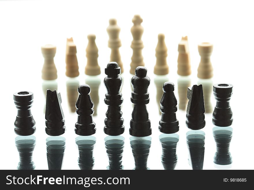 Chess game composition. Army of black chess figures against white