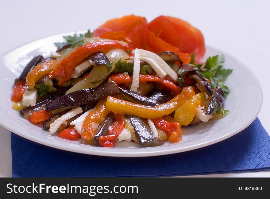 Salad of braised eggplant with pepper, filled cheese and oil. Salad of braised eggplant with pepper, filled cheese and oil