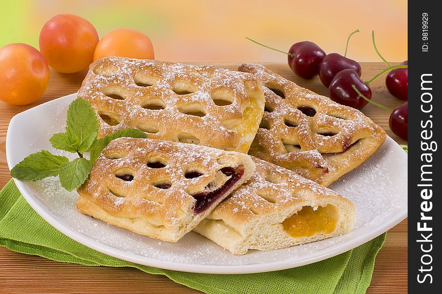 Sweet pastry filled with cherry and apricot jam. Sweet pastry filled with cherry and apricot jam