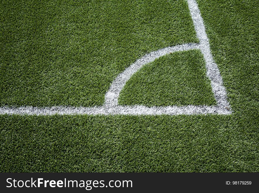 Corner painted on a football field, detail of a playing field, sport and competition