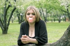 Beauty Blond Girl Blowing Bubble Gum Stock Image