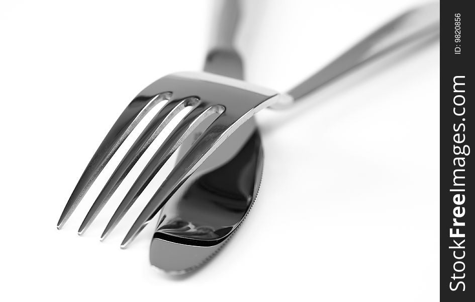Fork and knife isolated over white background