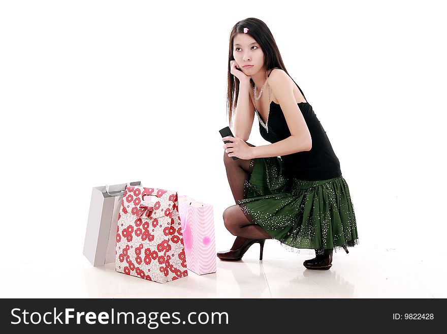 Asian shopping girl is waiting for her friend anxiously.