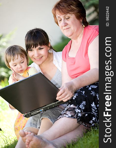 Happy family together relaxing in park. Happy family together relaxing in park