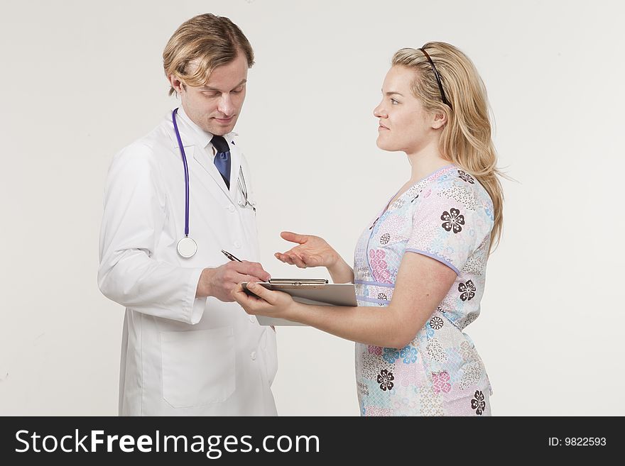 Portrait of two medical professionals conversing. Portrait of two medical professionals conversing