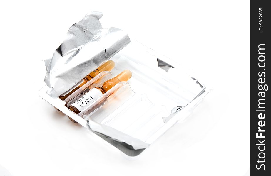 Medicine in ampoules of brown, white background. Medicine in ampoules of brown, white background