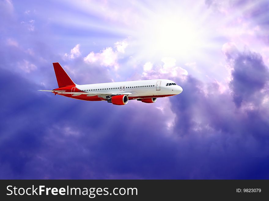 Airplane in air on blue sky