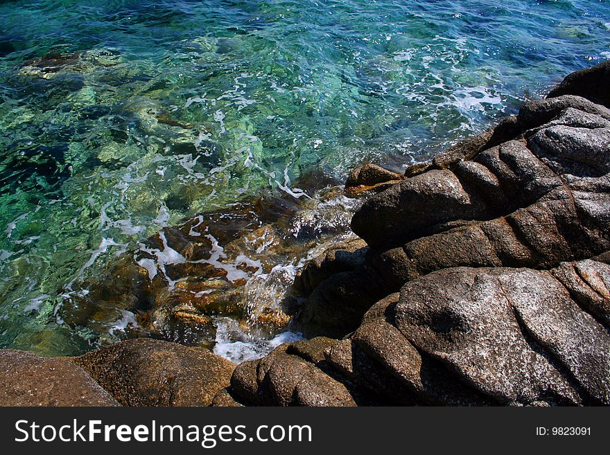 Seashore with rocks and beautiful clera water
