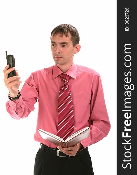 The businessman speaks on the phone on to isolated a background. The businessman speaks on the phone on to isolated a background
