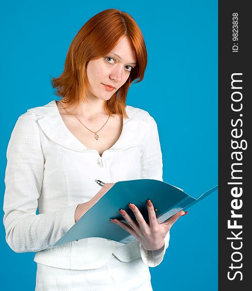 Pretty secretary held folder, isolated on blue background