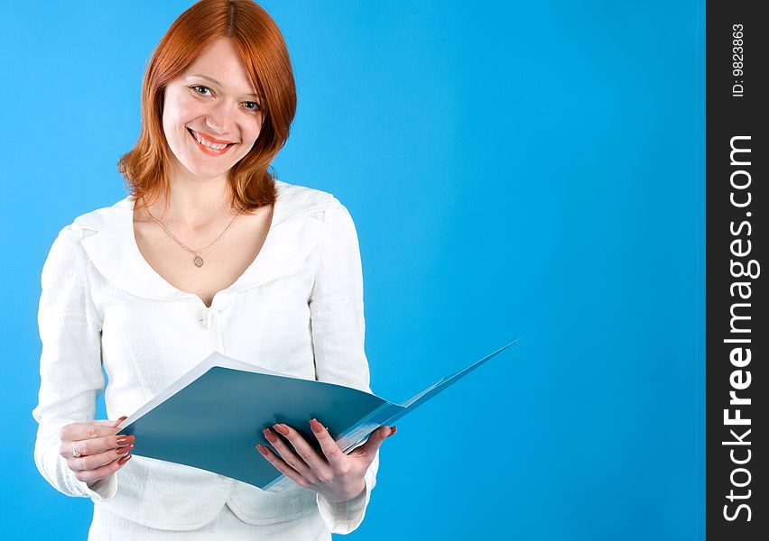 Pretty secretary held folder, isolated on blue background