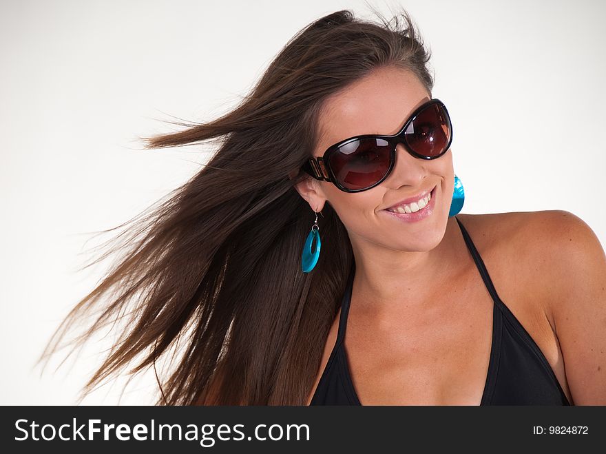 Attractive young woman wearing sun glasses. Attractive young woman wearing sun glasses