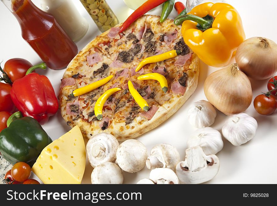 A couple of delicious pizzas, with raw tomatoes, green peppers and mushrooms. A couple of delicious pizzas, with raw tomatoes, green peppers and mushrooms