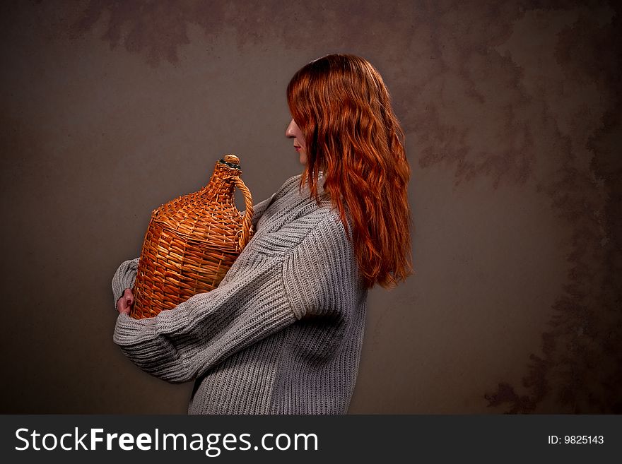 Pretty young woman standing backwards with jar isolated. Pretty young woman standing backwards with jar isolated