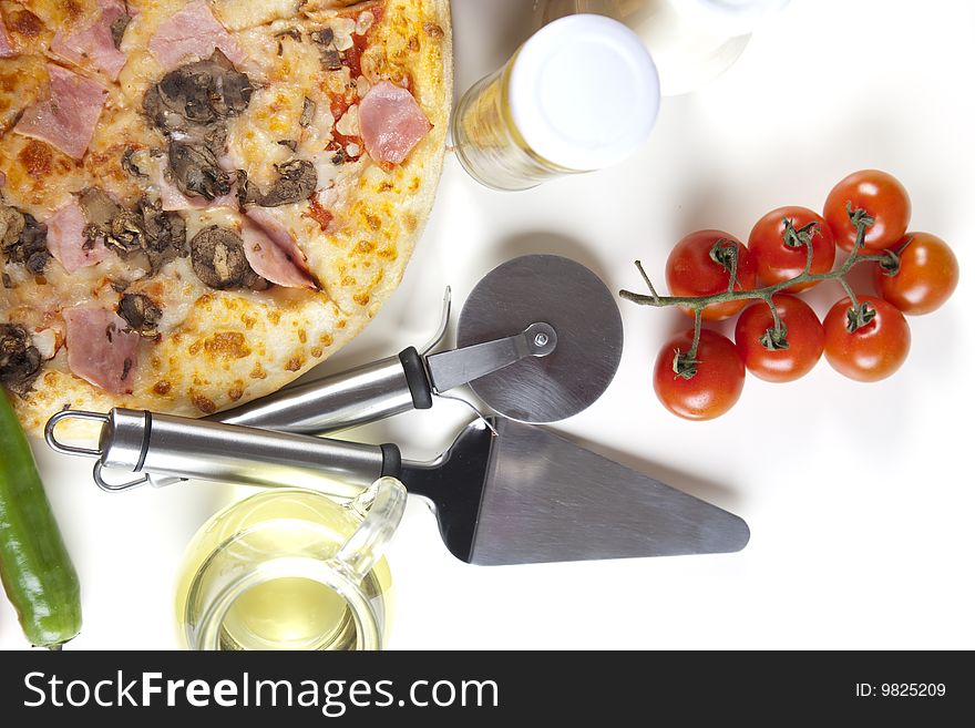 A couple of delicious pizzas, with raw tomatoes, green peppers and mushrooms. A couple of delicious pizzas, with raw tomatoes, green peppers and mushrooms