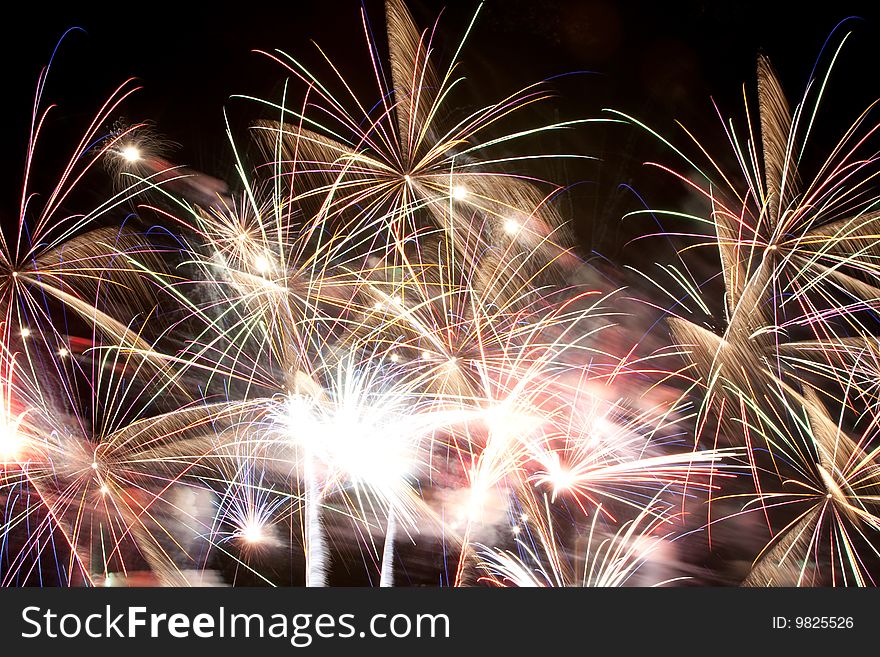 Vibrant explosive colors from a beautiful fireworks display on the Fourth of July. Vibrant explosive colors from a beautiful fireworks display on the Fourth of July.