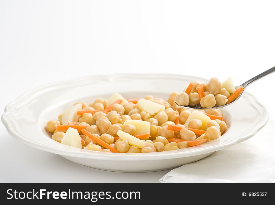 Chickpeas delicious homemade carrot and potato dish isolated. Chickpeas delicious homemade carrot and potato dish isolated