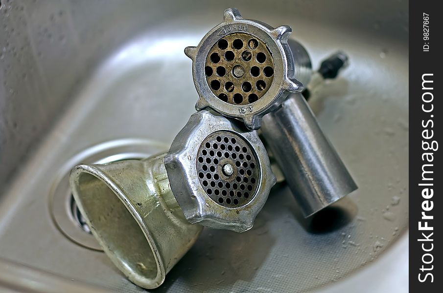 Pair of clean meat grinders after sink. Pair of clean meat grinders after sink