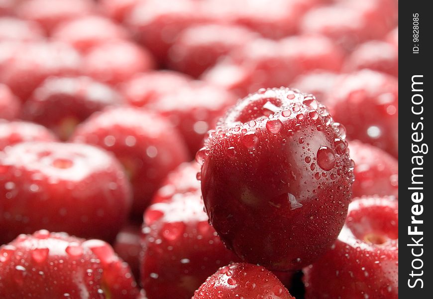 Wet ripe red cherry background. Wet ripe red cherry background.