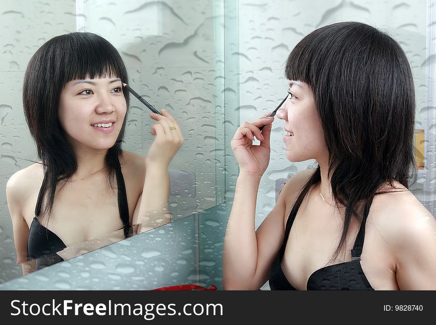 Asian girls in the bathroom with make-up. Asian girls in the bathroom with make-up.