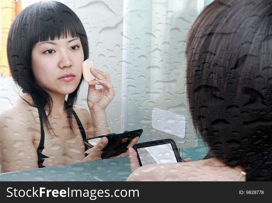 Asian girls in the bathroom with make-up. Asian girls in the bathroom with make-up.