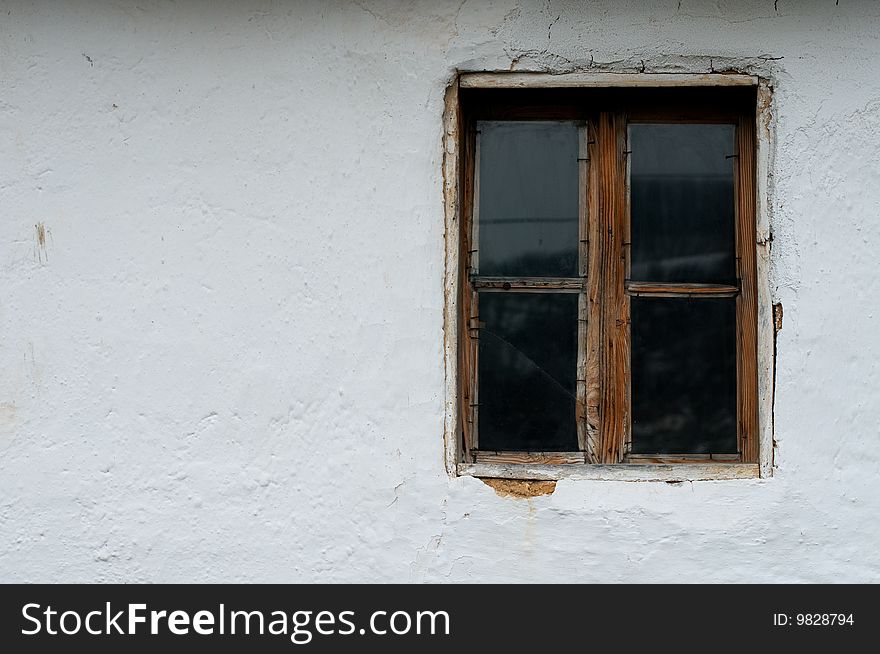 Old wooden window and wall of mud. Old wooden window and wall of mud