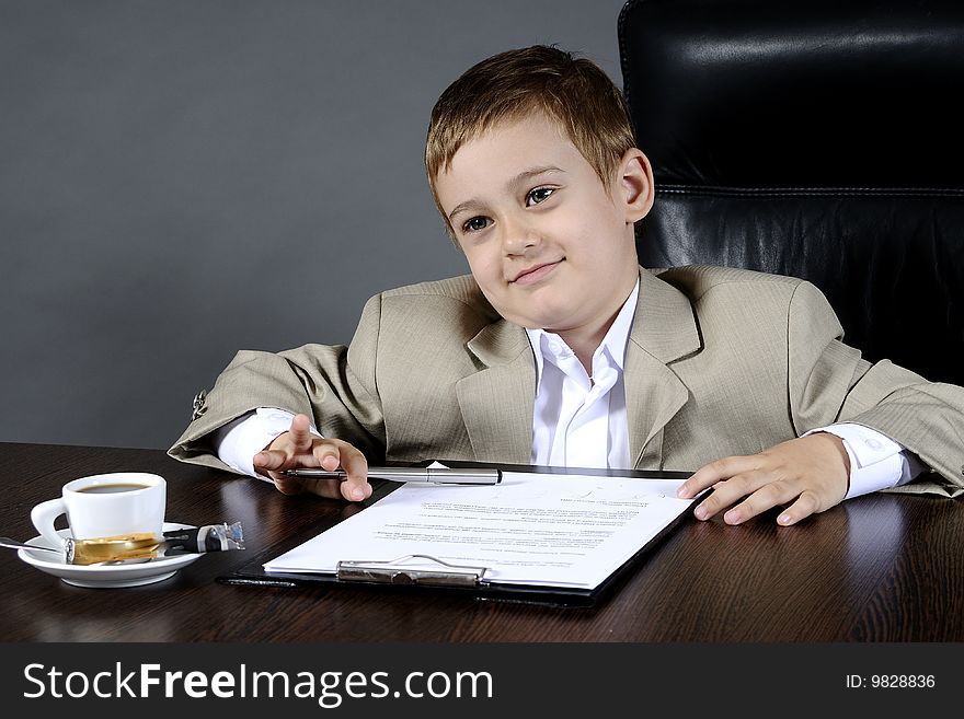 Close-up of small boy discussing in office. Close-up of small boy discussing in office
