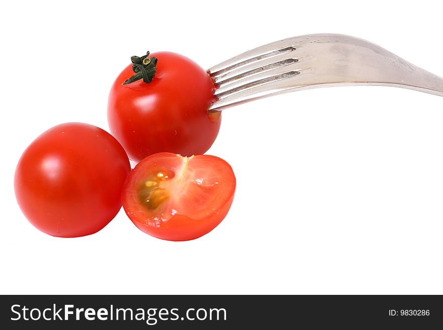 Detail of tomatoes with fork. Detail of tomatoes with fork