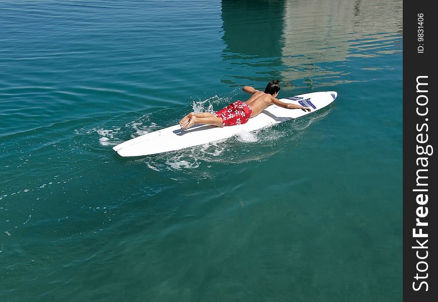 Boy Speed Surfing On Sea