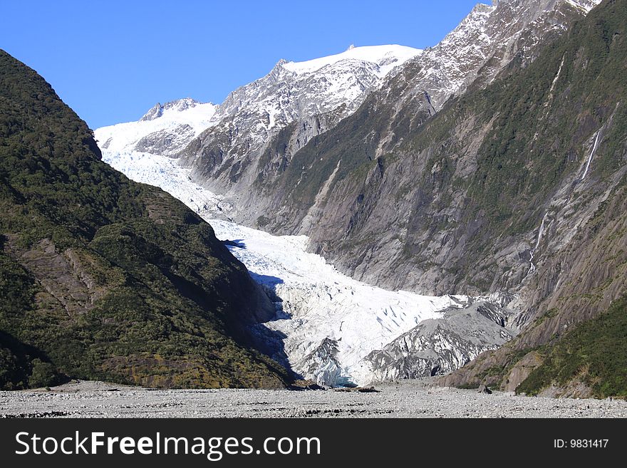 View of New Zealands Franz Joesph glacier flowing towards the sea. View of New Zealands Franz Joesph glacier flowing towards the sea