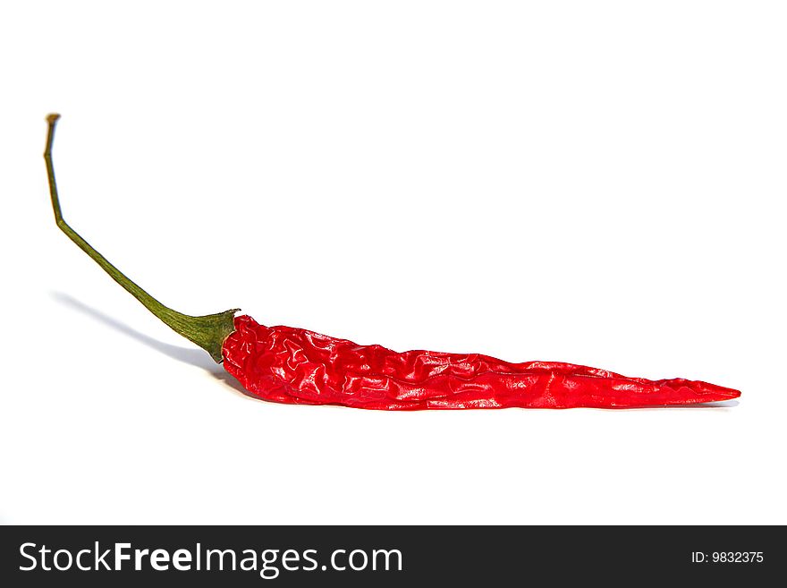 An image of a red chilli over white background