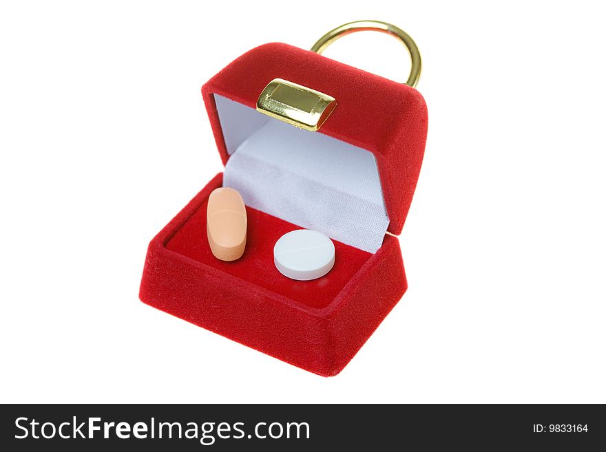 Pills in red present container