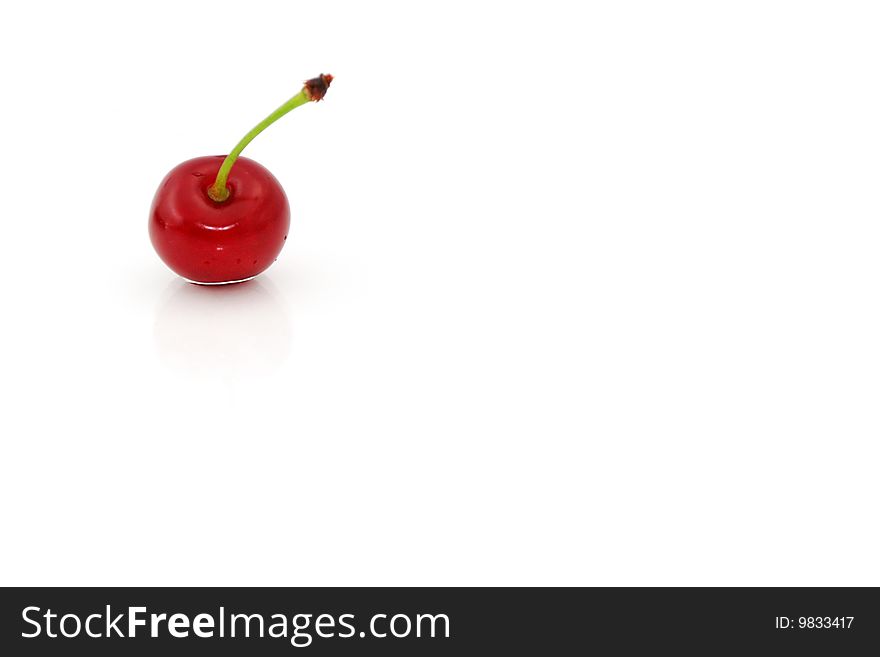 Single red cherry isolated on white. Single red cherry isolated on white