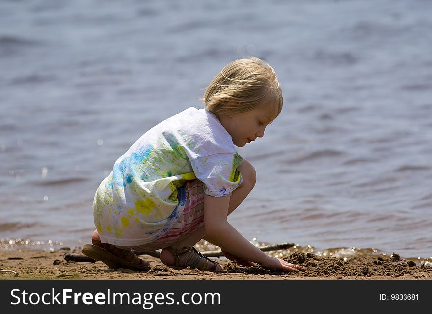 Child Playing at Beach