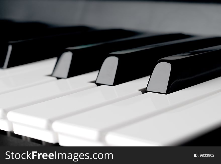 Horizontal close up of piano keyboard keys