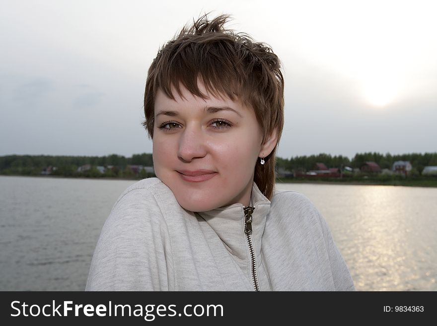 Portrait of frozen woman in Neva river background