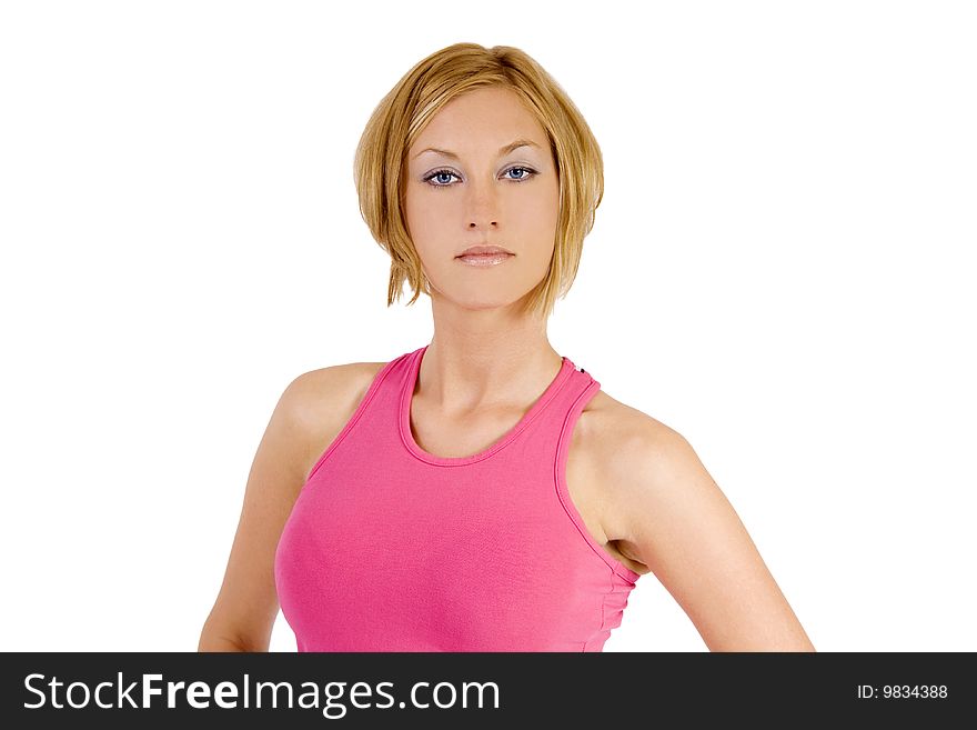 A blond female fitness instructor wearing a pink top. A blond female fitness instructor wearing a pink top.