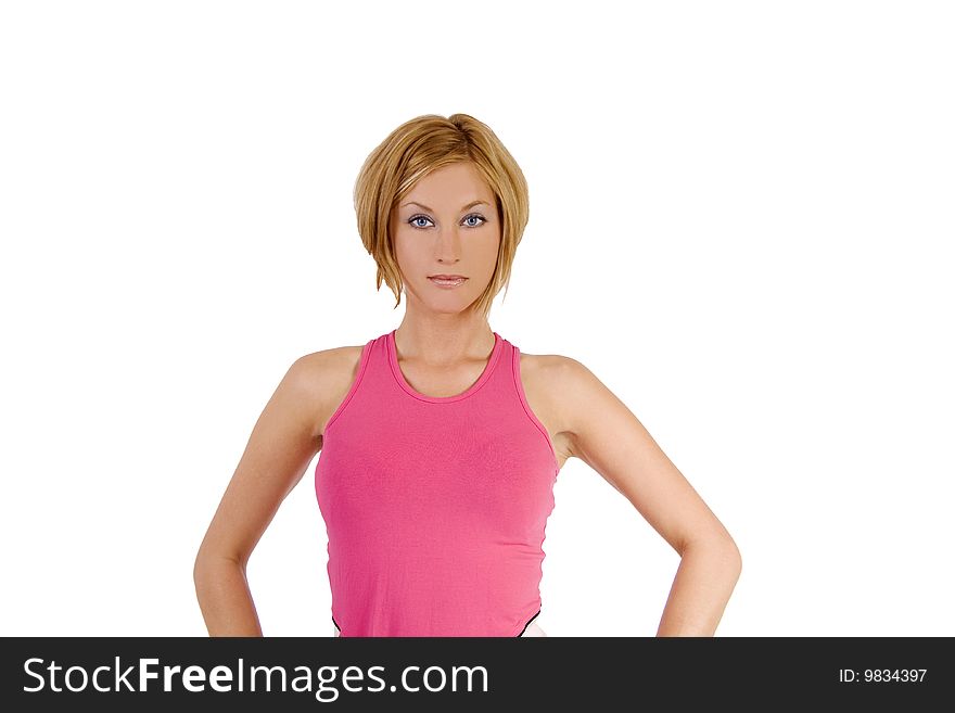 A blond female fitness instructor wearing a pink top. A blond female fitness instructor wearing a pink top.