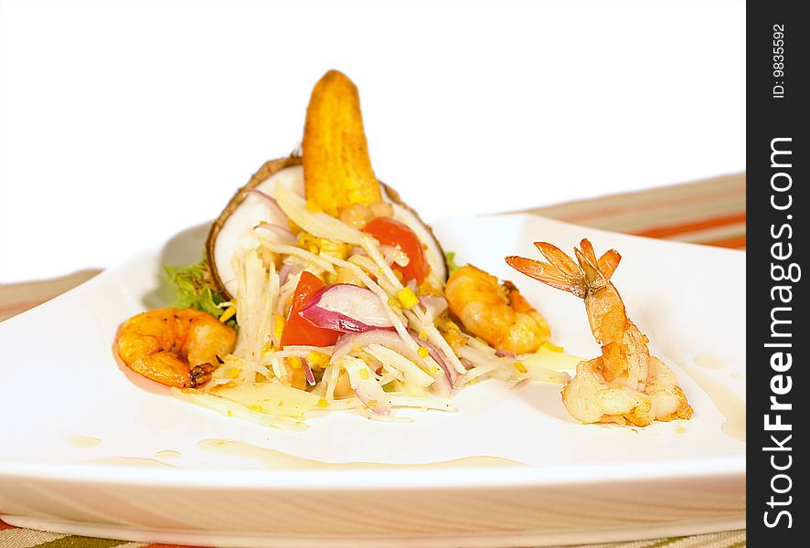 Jumbo shrimp salad with a fried plantain for decoration