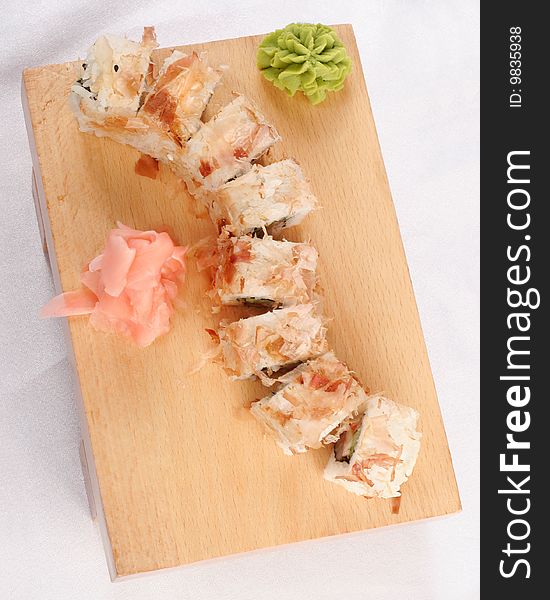 Sushi roll on wood plate. Top view
