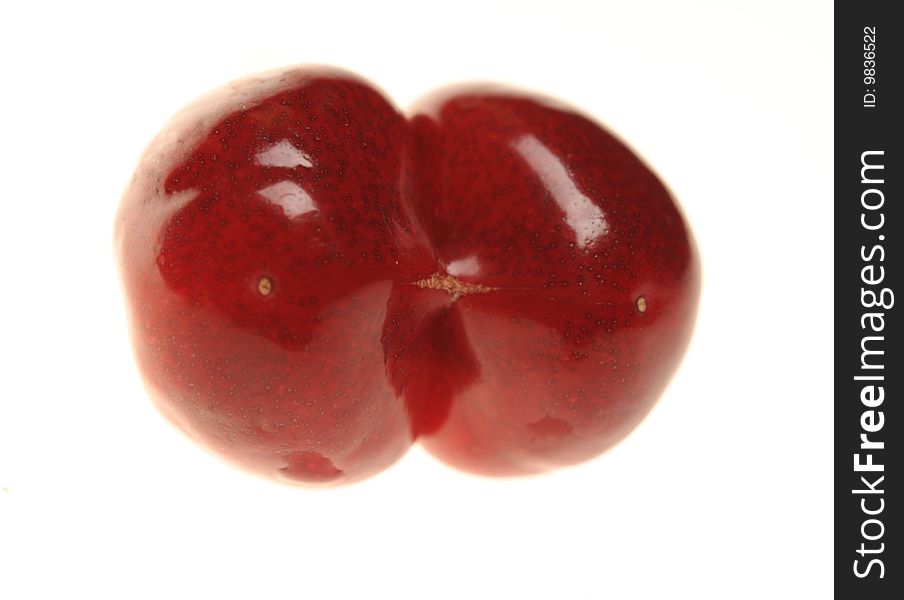 Double red cherry on white background. Double red cherry on white background