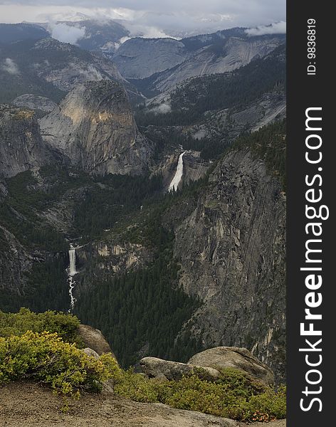 View of Merced River waterfalls on a stormy evening from Glacier Point in Yosemite National Park, California. View of Merced River waterfalls on a stormy evening from Glacier Point in Yosemite National Park, California