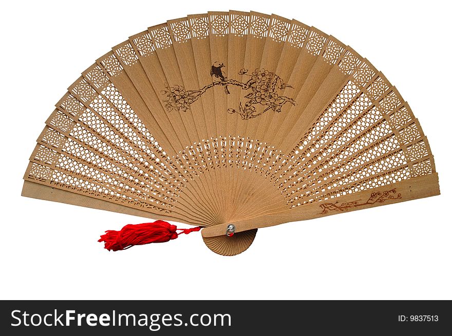 Openwork wooden fan on the white background