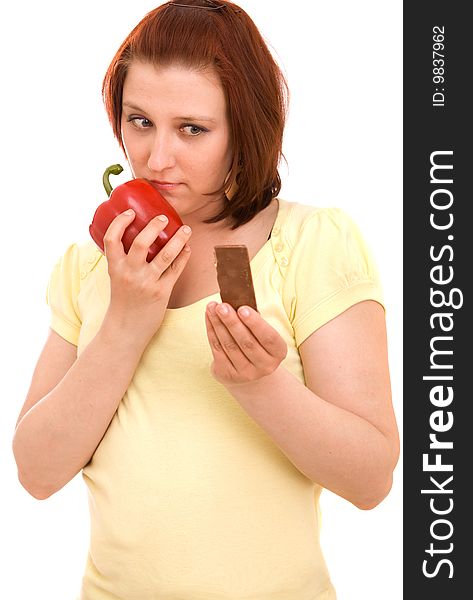 Woman eating vegetables on white background