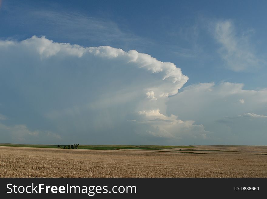 Dramatic sky over a prairie farm. Dramatic sky over a prairie farm