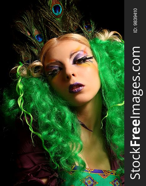 Girl-peacock in dress with green hairs. Girl-peacock in dress with green hairs