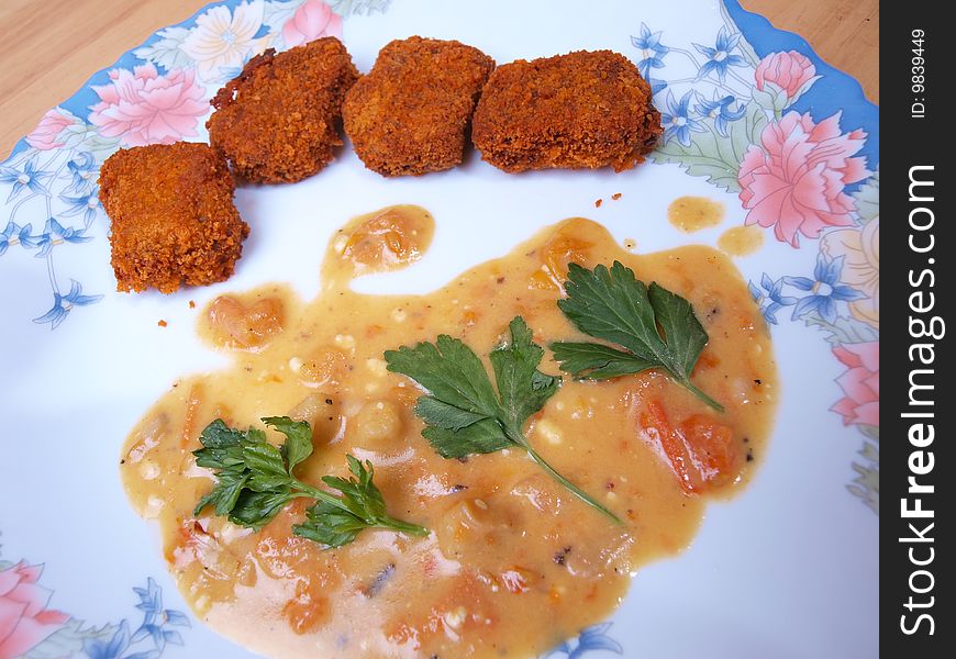 Close-up crispy beef nuggets mustard gravy picture one. Close-up crispy beef nuggets mustard gravy picture one