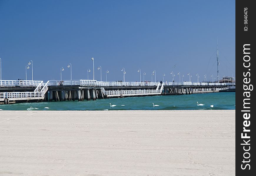 A long pier on a bright day