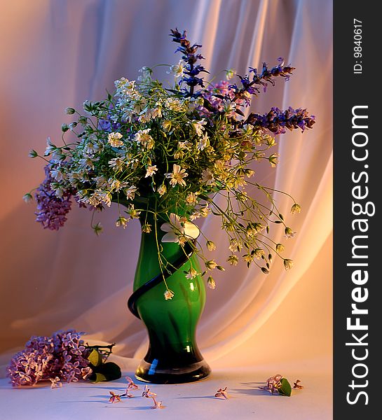 Bouquet of the flowers in green vase