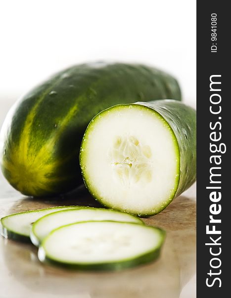 Green cucumber on a stone counter